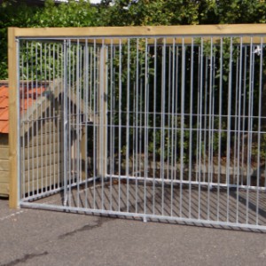 The dog kennel is provided with a wooden frame