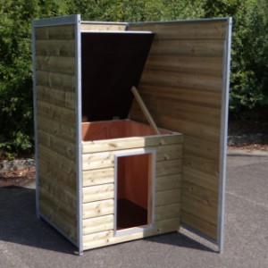The insulated night shelter is suitable for a large dog, such as a German Shepherd