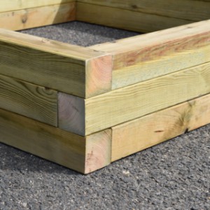 The wooden sandbox Solution has a solid construction