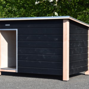 The "Loebas" dog house is made of black-impregnated spruce wood and finished with a Douglas fir frame.