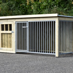 The dog kennel is provided with 2 bar panels and a flat roof