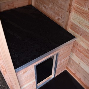 The dog kennel is provided with an insulated sleeping compartment