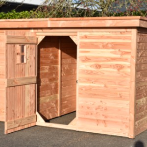 The kennel's shed features a spacious door opening for easy access.