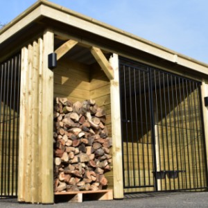 A dog kennel, storage room and fire wood compartment under 1 roof!