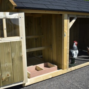 The chickencoop has a laying box and 2 perches