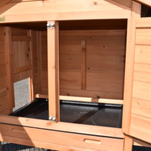The sleeping area of the chicken coop Prestige Small is equipped with a perch