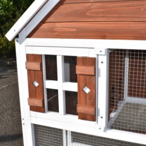 The sleeping compartment of the aviary Ninthe is provided with decorative shutters