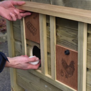 The Chicky 2 chicken coop has convenient side hatches, allowing you to easily collect the eggs