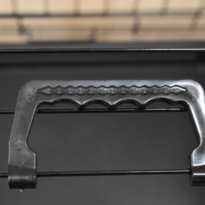 The dog crate is equipped with a practical handle