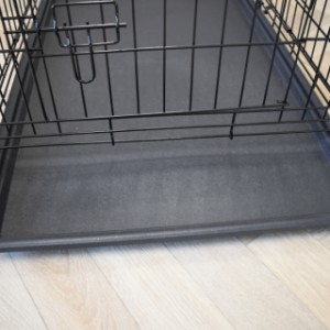 The dog crate is equipped with a removable tray