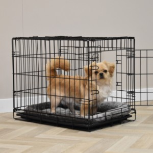 The Profit 63 cm dog crate comes with a soft cushion included