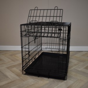 The Strong M dog crate has a flap door on the short side.