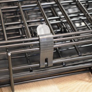 The Strong L dog crate has a black clip so that the crate stays folded