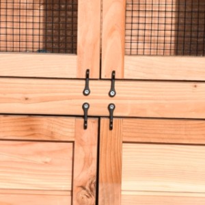The doors are fitted with black twist hook latches