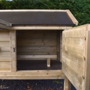 The handy door makes chicken coop Eggy easy to clean.