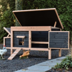 The chicken coop is easy to clean thanks to the hinged roof and door.