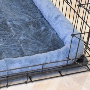 A matching cushion is included with the Profit 63 cm dog crate