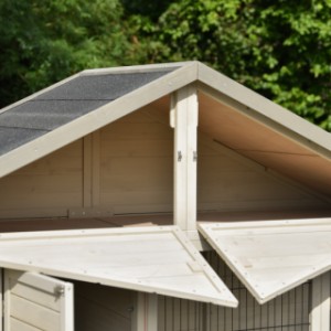 The Holiday Large rabbit hutch features a convenient storage loft under the roof, accessible from the front.