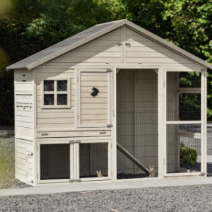 The modern look of the Holiday Large rabbit hutch fits perfectly in a contemporary garden.