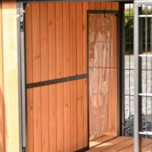 Dog house Danielle | The opening from the run to the night shelter is fitted with a slatted door