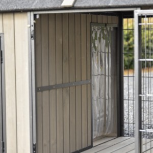 Dog house Danielle | The opening from the run to the night shelter is fitted with a slatted door
