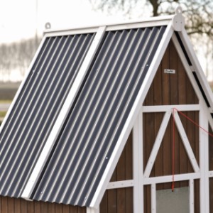 The roof of rabbit hutch Pip is made of plastic corrugated sheets