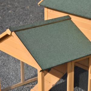 The roof of chicken coop Action is covered with dark green roofing felt