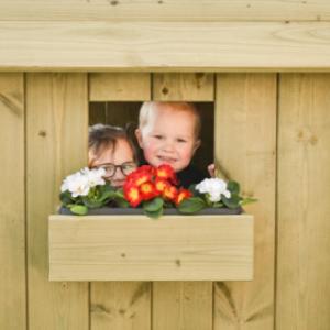 Playhouse Dream features a window with a charming flower box