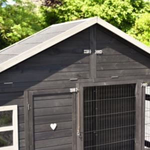 Holiday Large rabbit hutch has a practical storage loft under the roof, accessible from the front