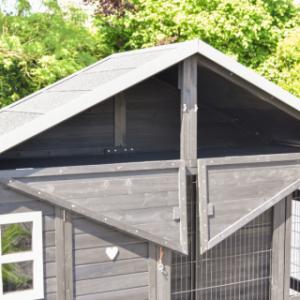 The Holiday Large chicken coop features a convenient storage loft under the roof, accessible from the front