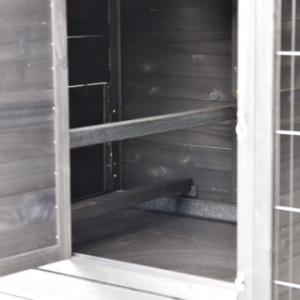 The lockable sleeping area of the Holiday Large chicken coop includes two sturdy perches.