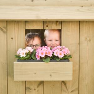 Playhouse Dream features a window with a charming flower box