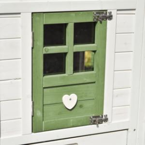 The Julia chicken coop is fitted with an olive-green door.