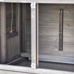 The sleeping area of the chicken coop Prestige Small is equipped with a perch