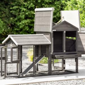 The Prestige Small chicken coop has many doors and hinged roofs.