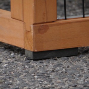 The Prestige Medium chicken coop stands on rubber feet to protect it from rising moisture