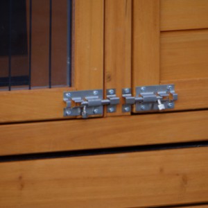 The Prestige Small rabbit hutch is fitted with sturdy sliding locks