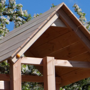 Play equipment Kiosk low is provided with a wooden pointed roof