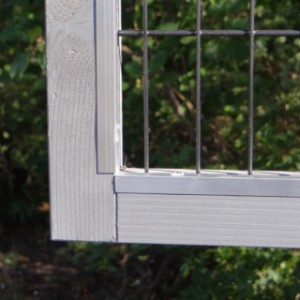 The wooden hutch is provided with aluminum chewprotection strips