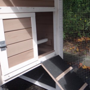 The sleeping compartment of rabbit hutch Leah has a large opening